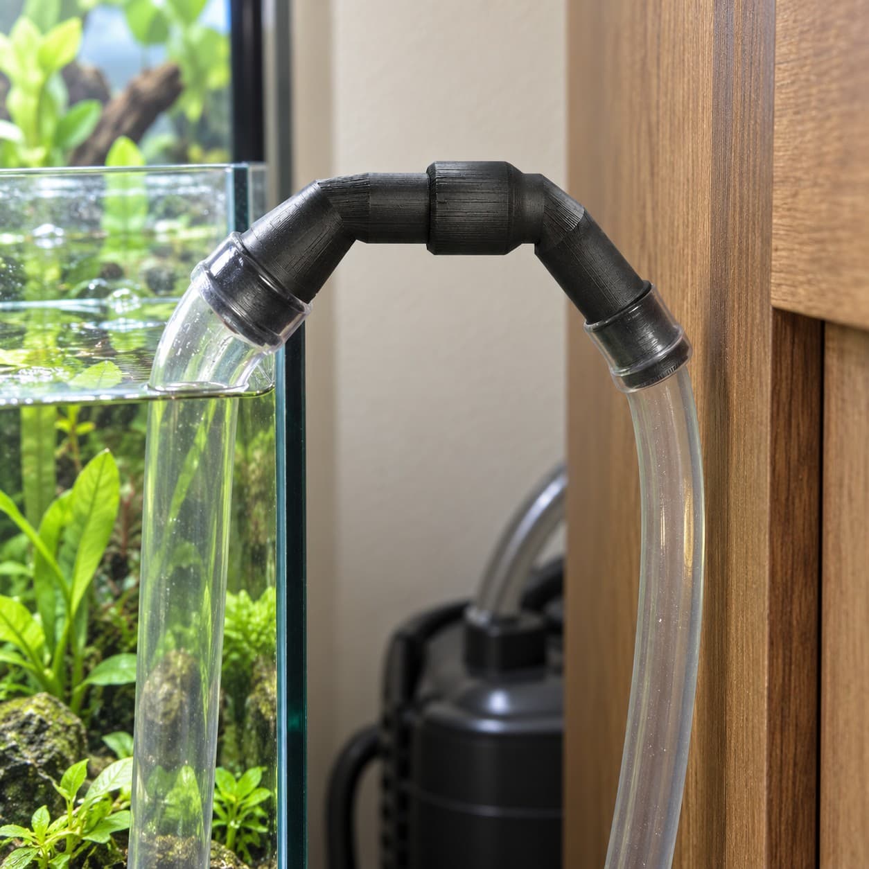 Eheim 12/16mm to 3/4 Inch Vinyl Barb Elbow Adapter, 90 Degree, Black, shown in an aquarium setup