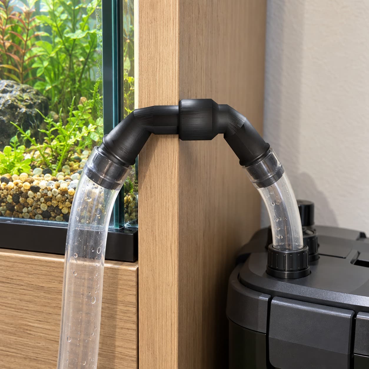 Eheim 12/16mm to 5/8 Inch Vinyl Barb Elbow Adapter, 90 Degree, Black, shown in an aquarium setup