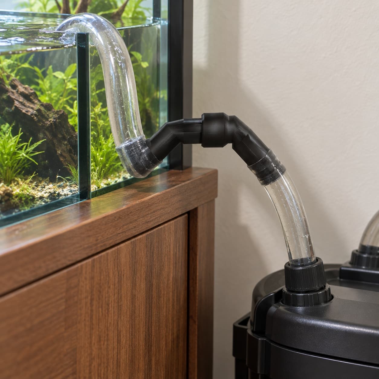Eheim 16/22mm to 5/8 Inch Vinyl Barb Elbow Adapter, 90 Degree, Black, shown in an aquarium setup