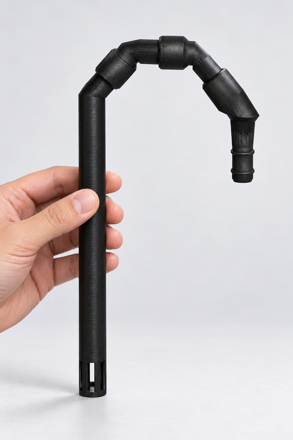 Lily Pipe Inflow Single, Eheim 12/16mm, Replacement, Black, held in a hand to show its size