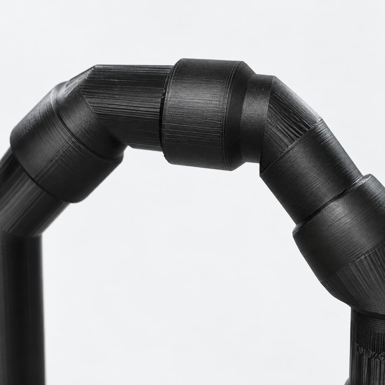 Lily Pipe Inflow Single, Eheim 16/22mm, Replacement, Black, close up of the printed surface